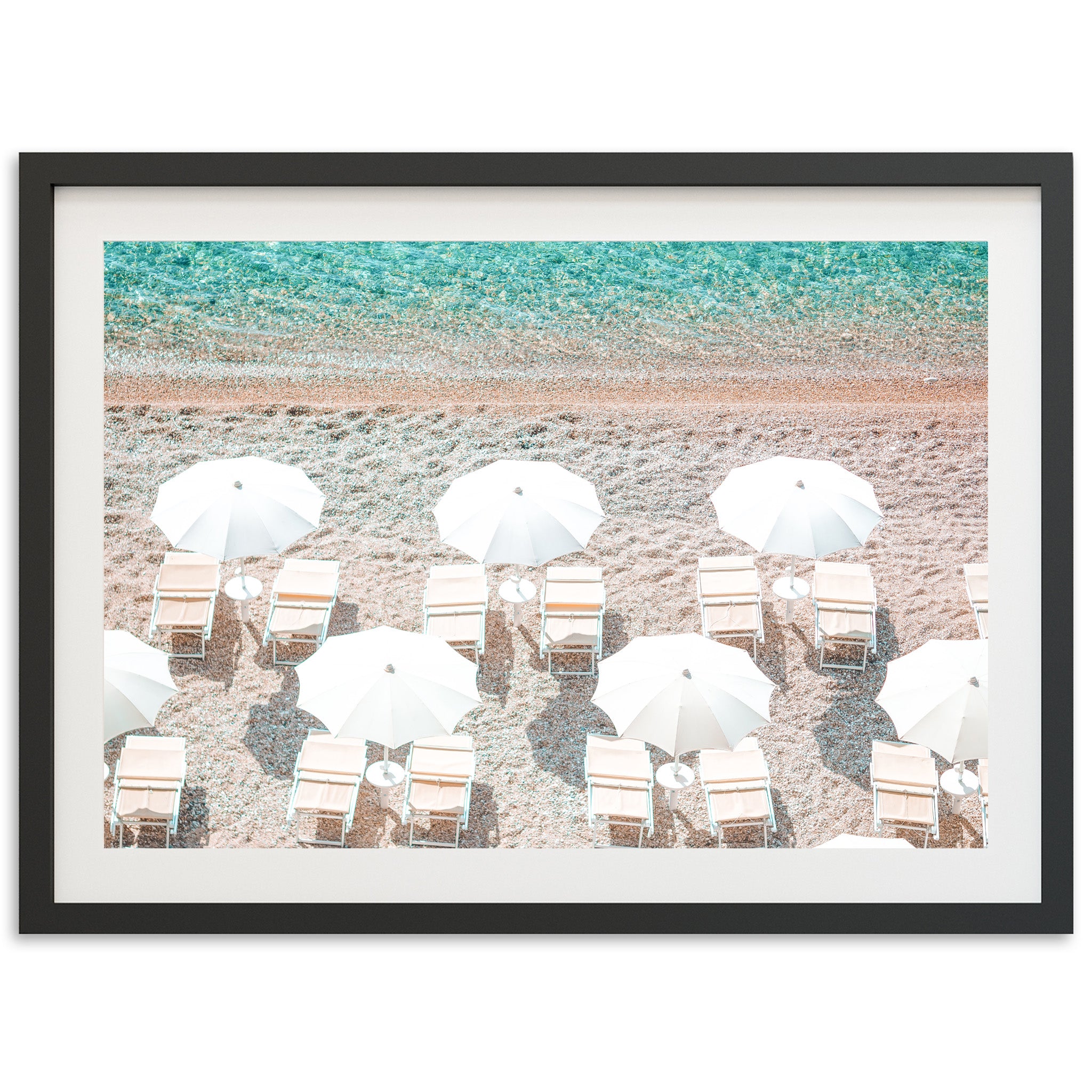 a group of chairs and umbrellas on a beach