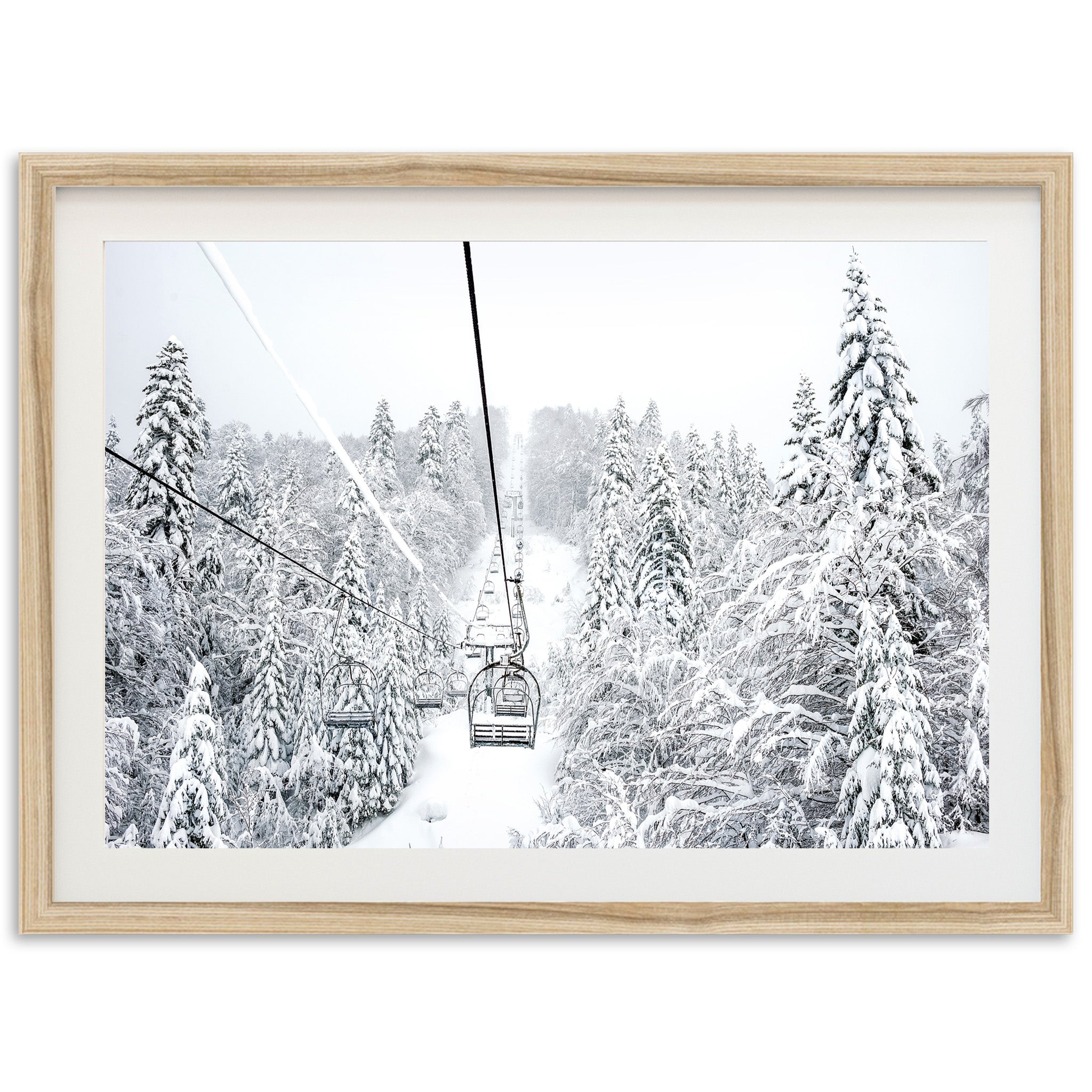 a black and white photo of a ski lift