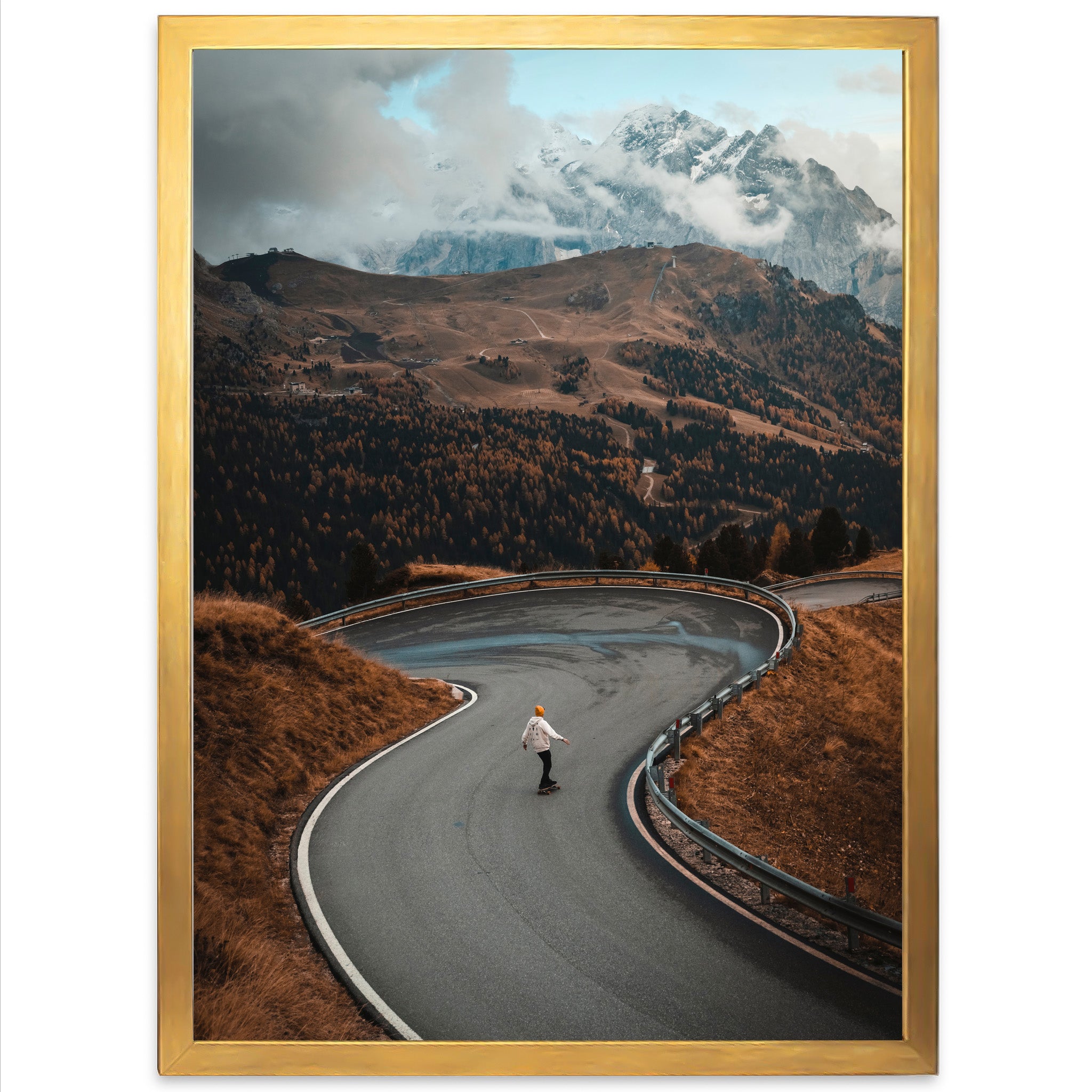 a man riding a skateboard down a curvy road