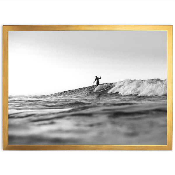 a man riding a wave on top of a surfboard