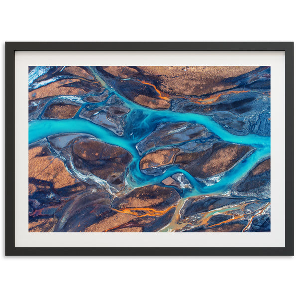 an aerial view of a river flowing through land