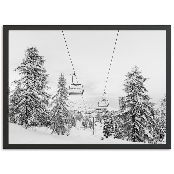 a black and white photo of a ski lift