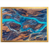 an aerial view of a river flowing through a valley