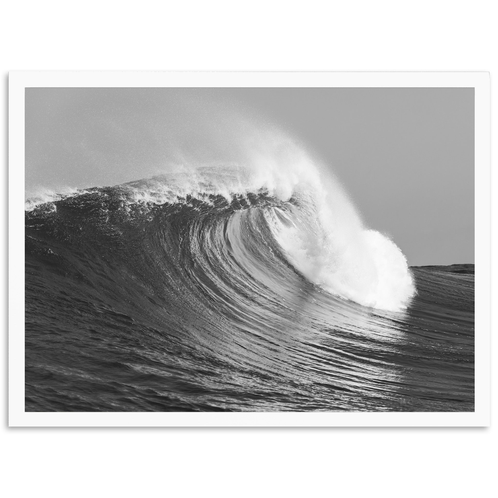 a black and white photo of a large wave