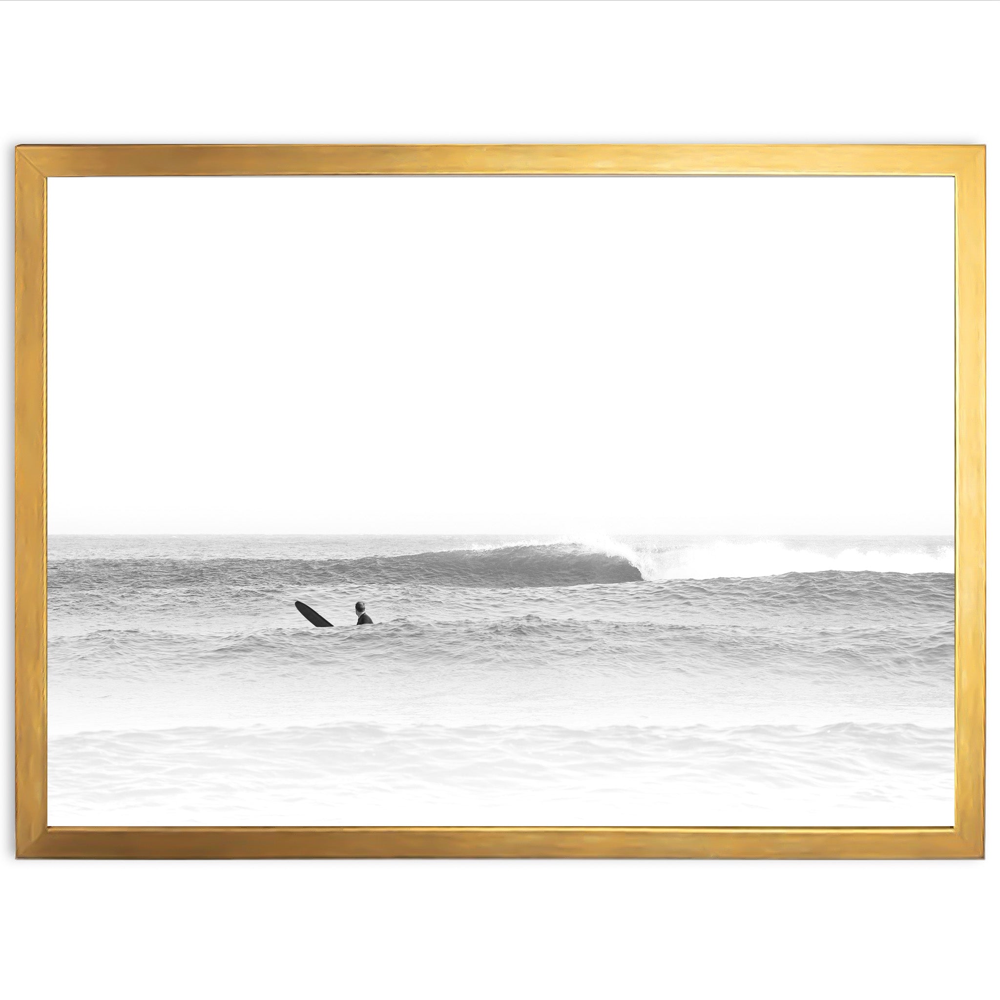 a black and white photo of a surfer riding a wave