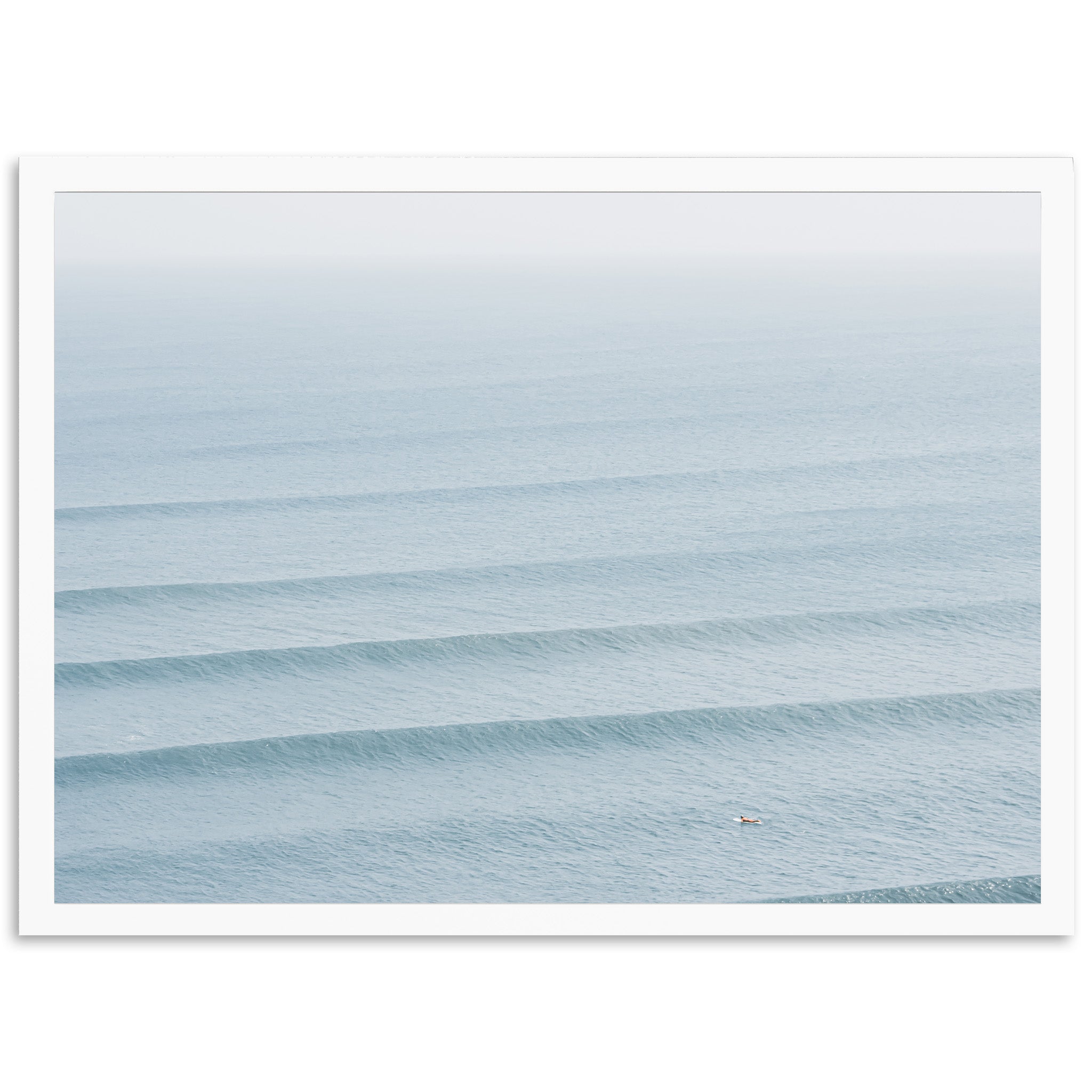 a person riding a surfboard on a wave in the ocean