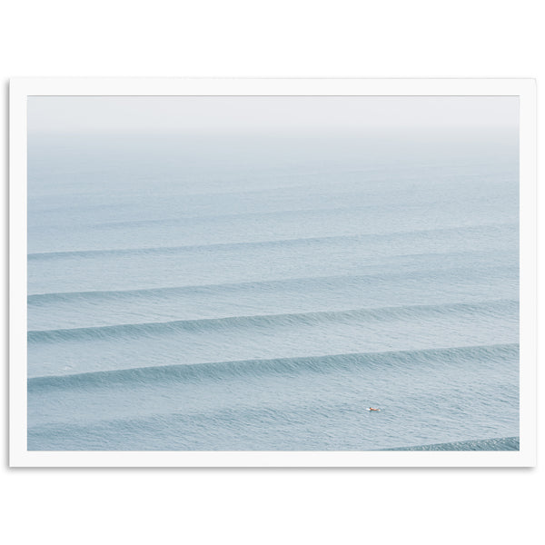 a person riding a surfboard on a wave in the ocean