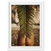 a picture of a palm tree with a woman's butt