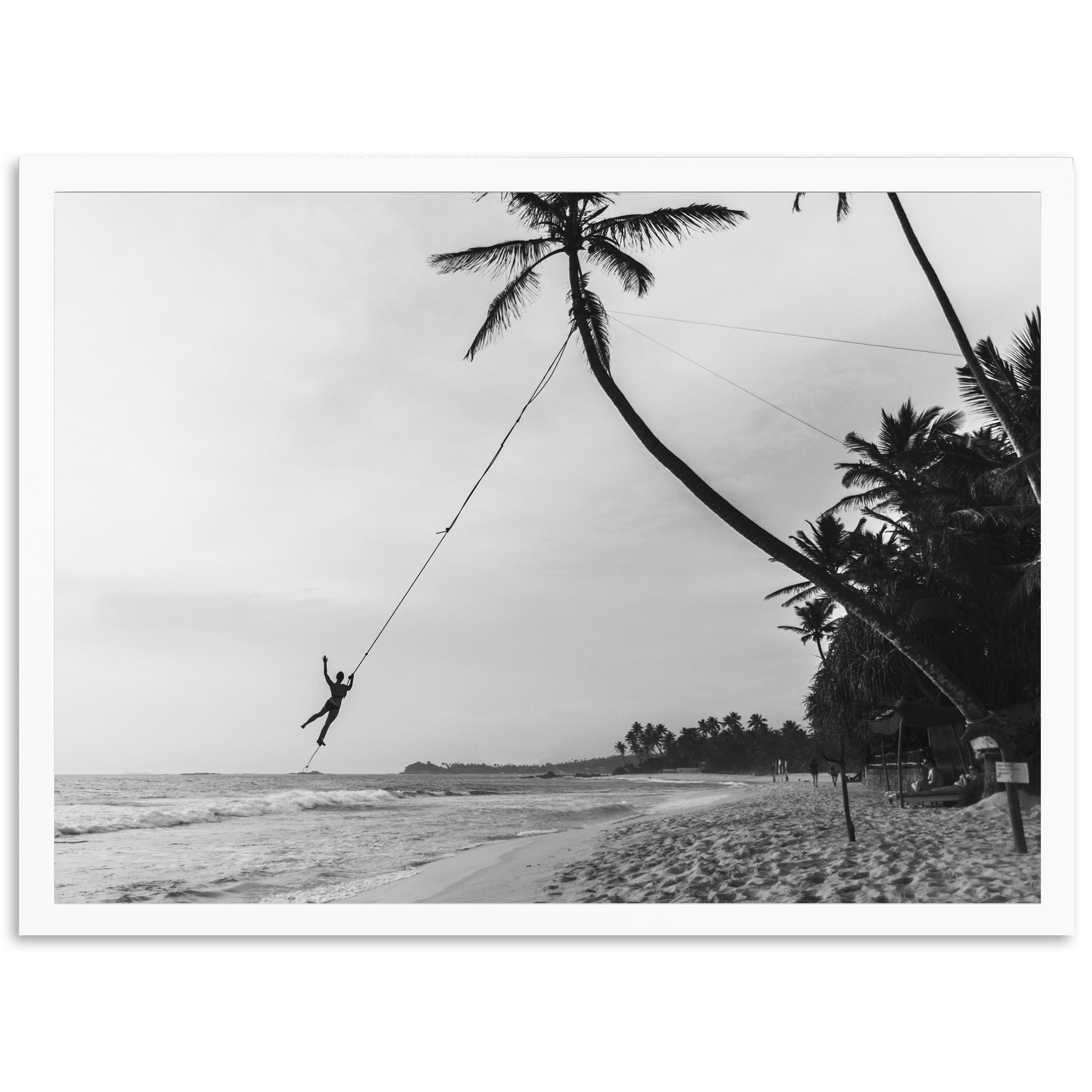 a black and white photo of a person on a rope