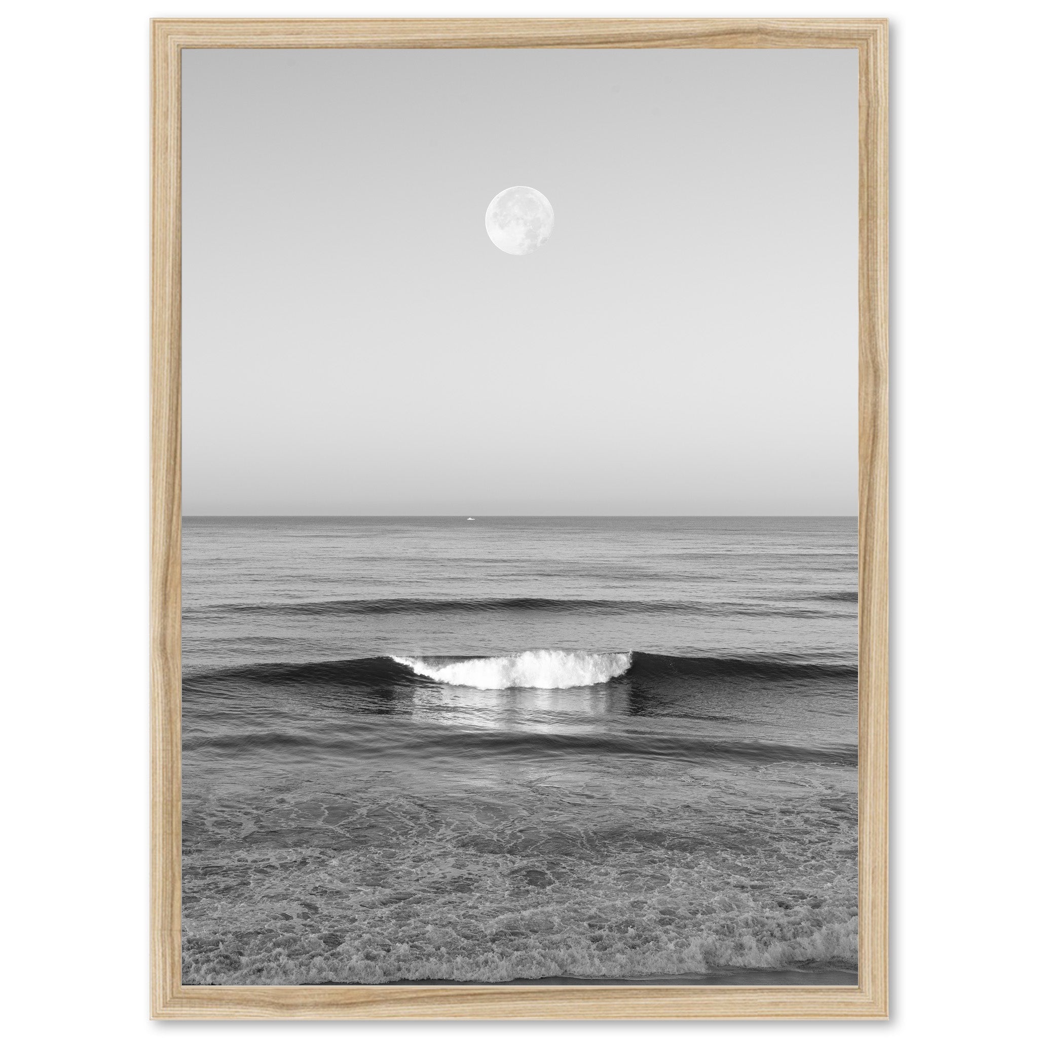 a black and white photo of a wave in the ocean