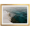 a picture of the ocean with a gold frame