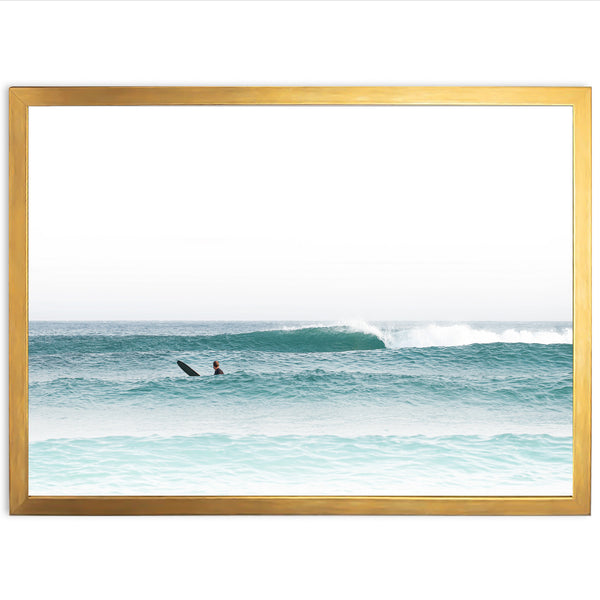 a person riding a surfboard on a wave in the ocean