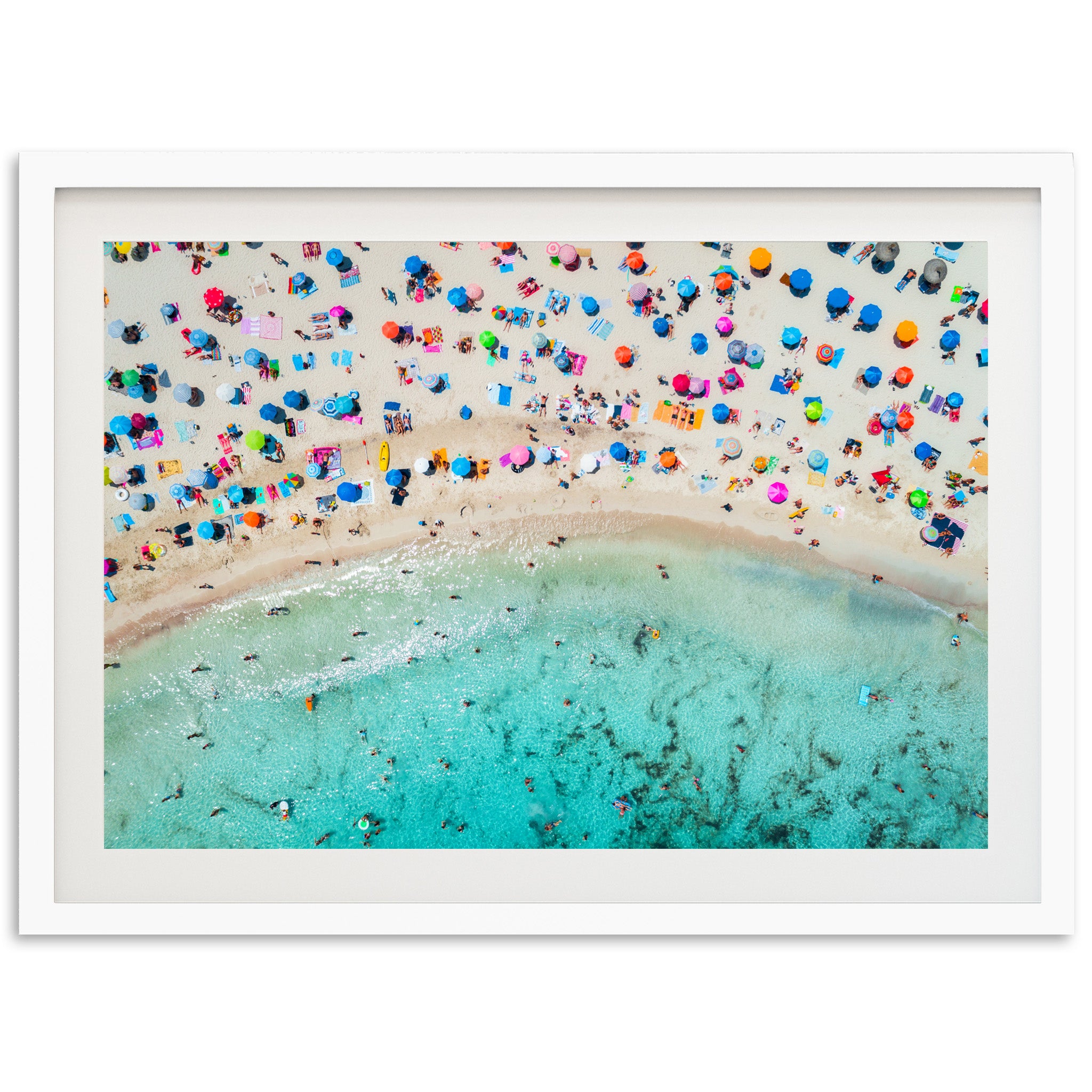 an aerial view of a beach with umbrellas