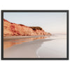 a picture of a beach with a cliff in the background