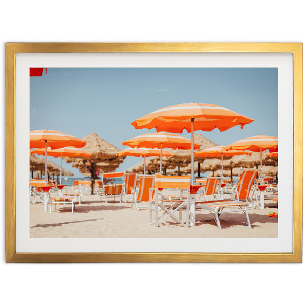 a group of chairs and umbrellas on a beach