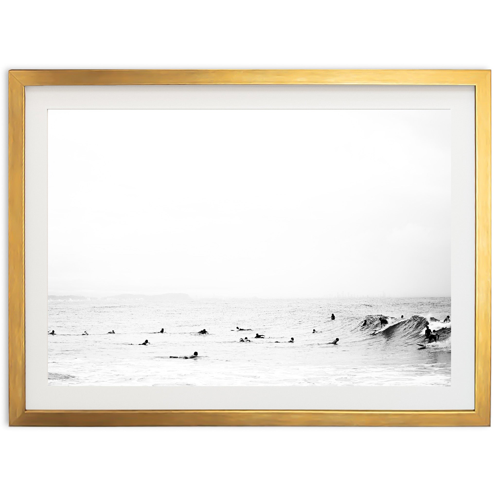 a black and white photo of surfers in the ocean