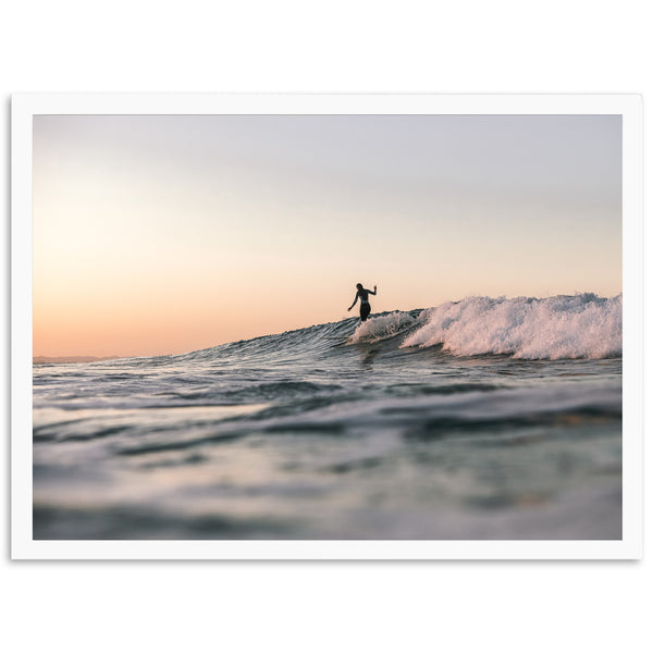 a person riding a wave on top of a surfboard