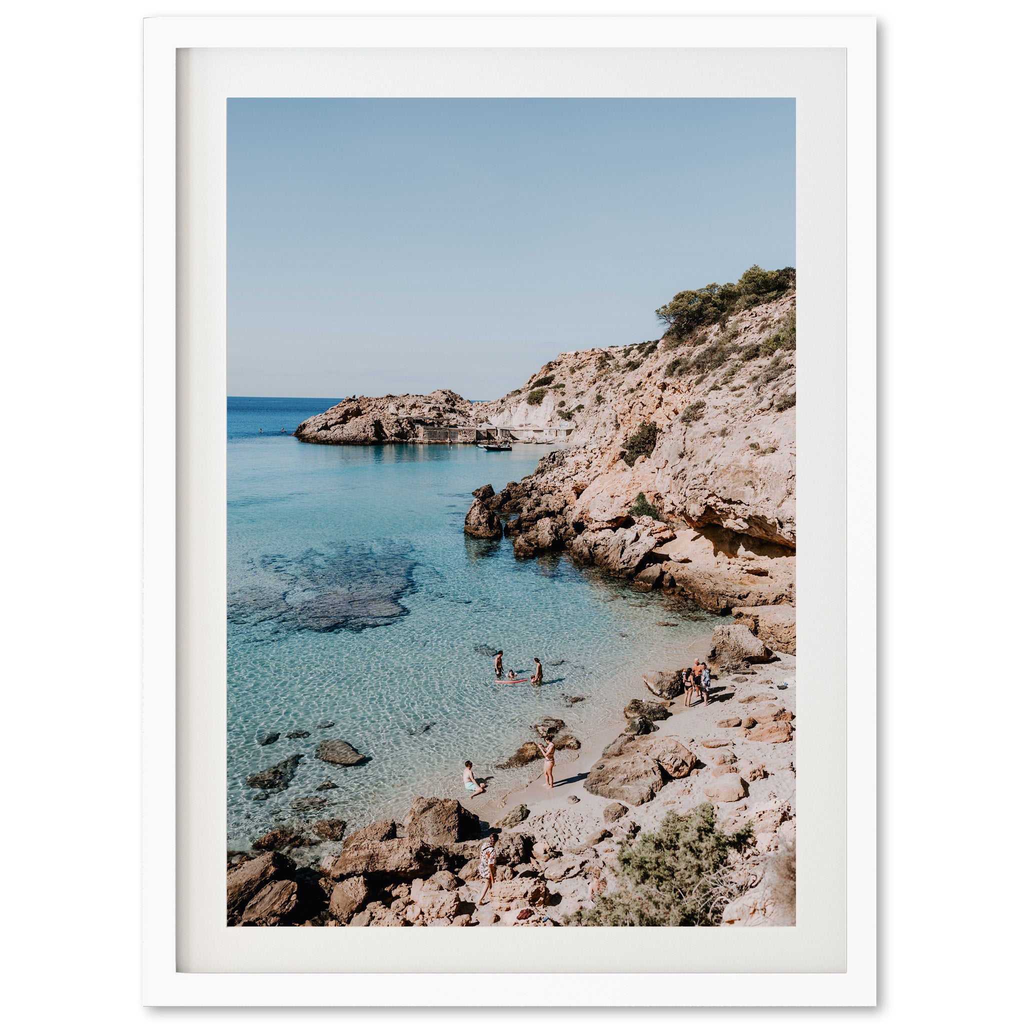 a picture of a beach with people swimming in the water