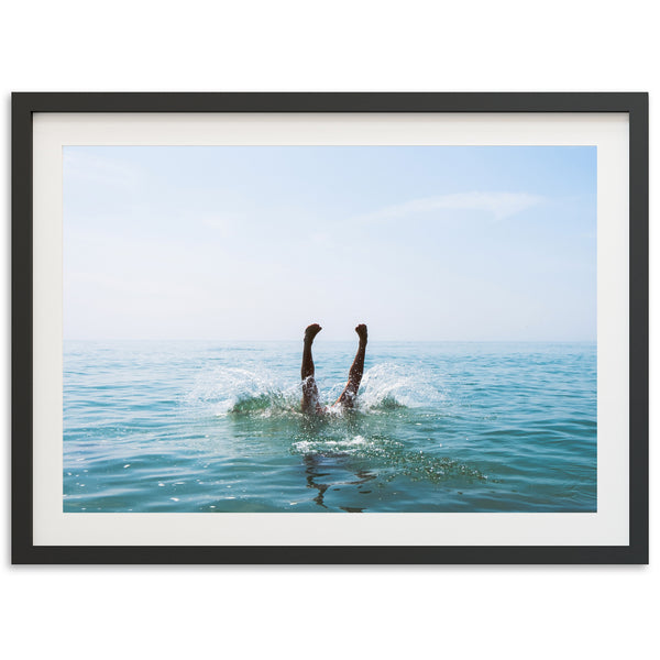 a picture of a person swimming in the ocean