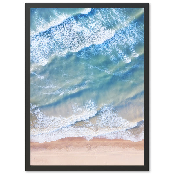 an aerial view of a beach with waves