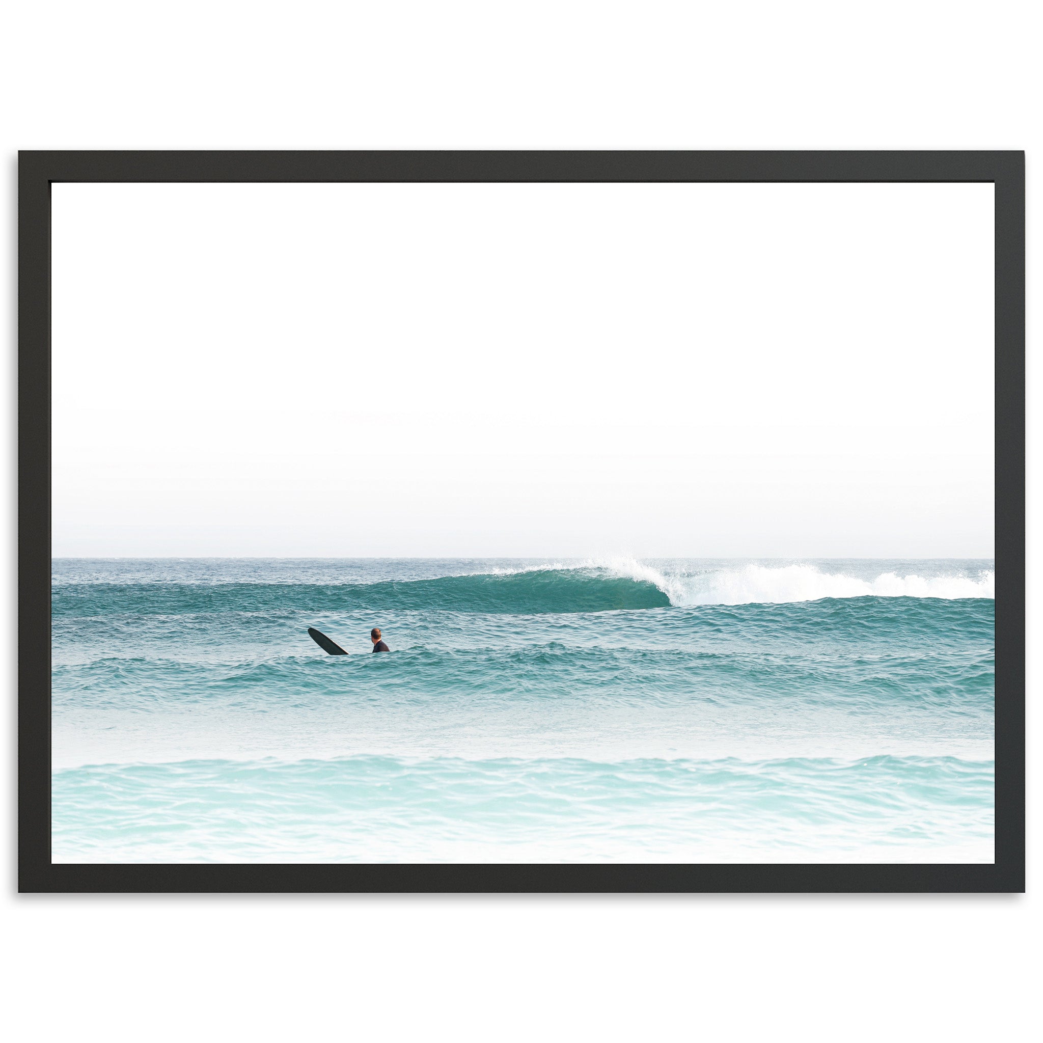 a man riding a surfboard on top of a wave in the ocean