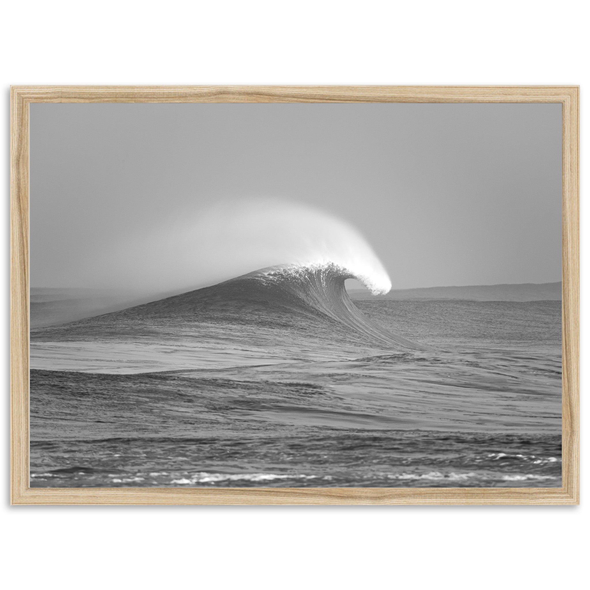 a black and white photo of a wave in the ocean