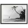 a black and white photo of a person on a rope