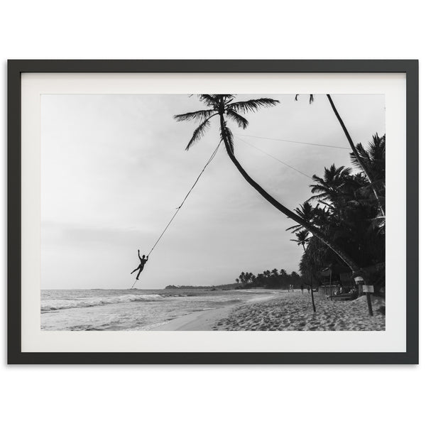 a black and white photo of a person on a rope