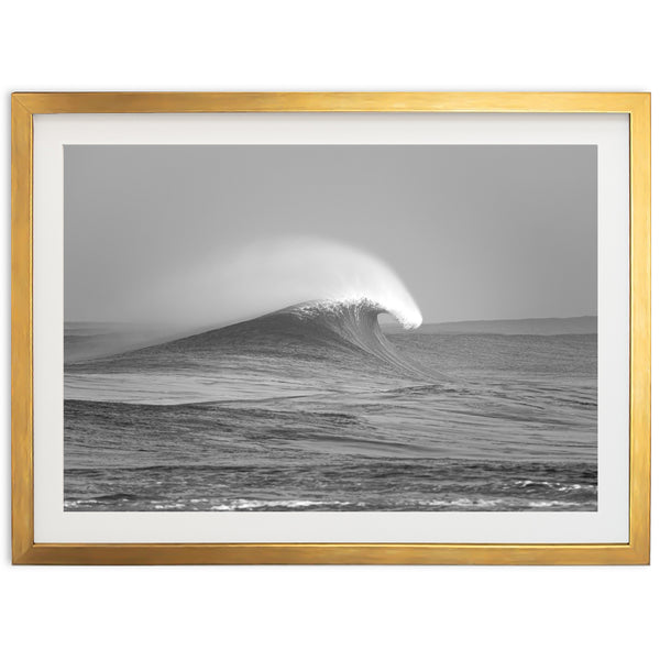 a black and white photo of a wave in the ocean