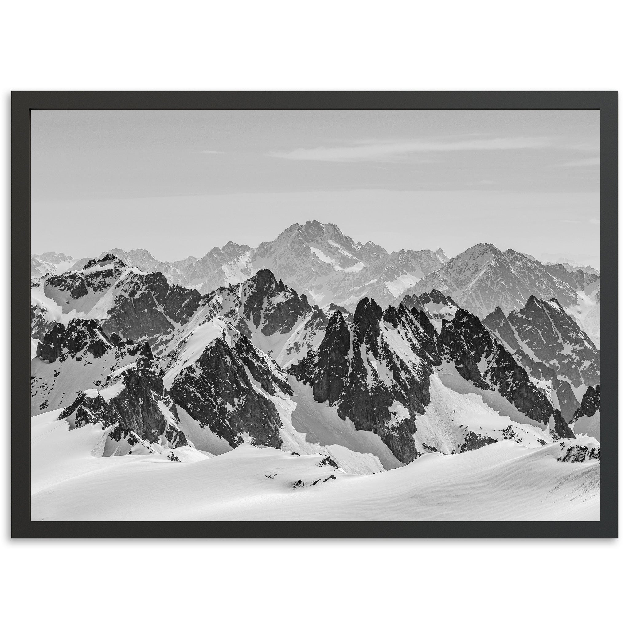 a black and white photo of a mountain range