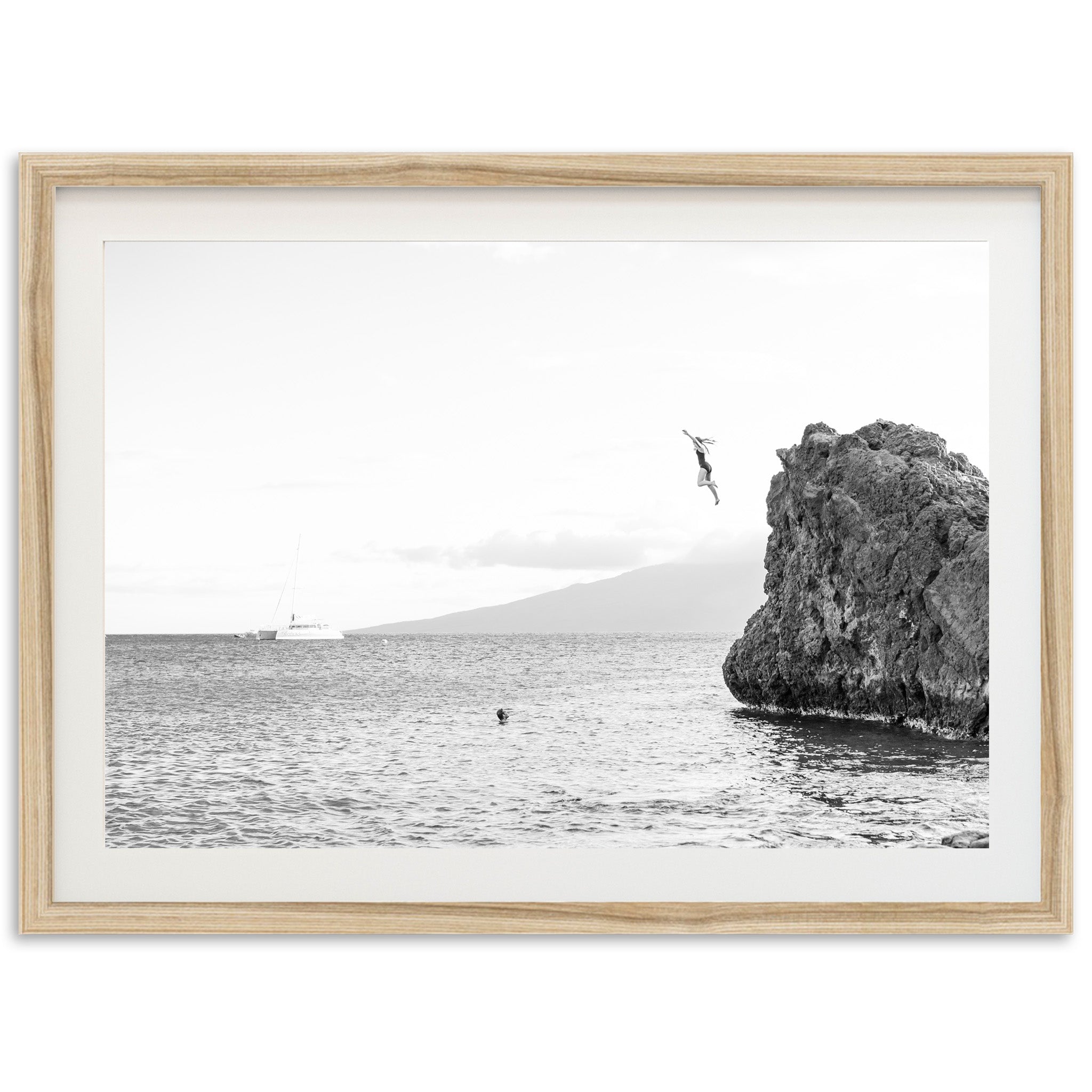 a black and white photo of a person in the water