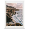 a picture of a beach with a cliff in the background