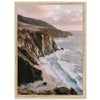 a picture of a beach with a cliff in the background