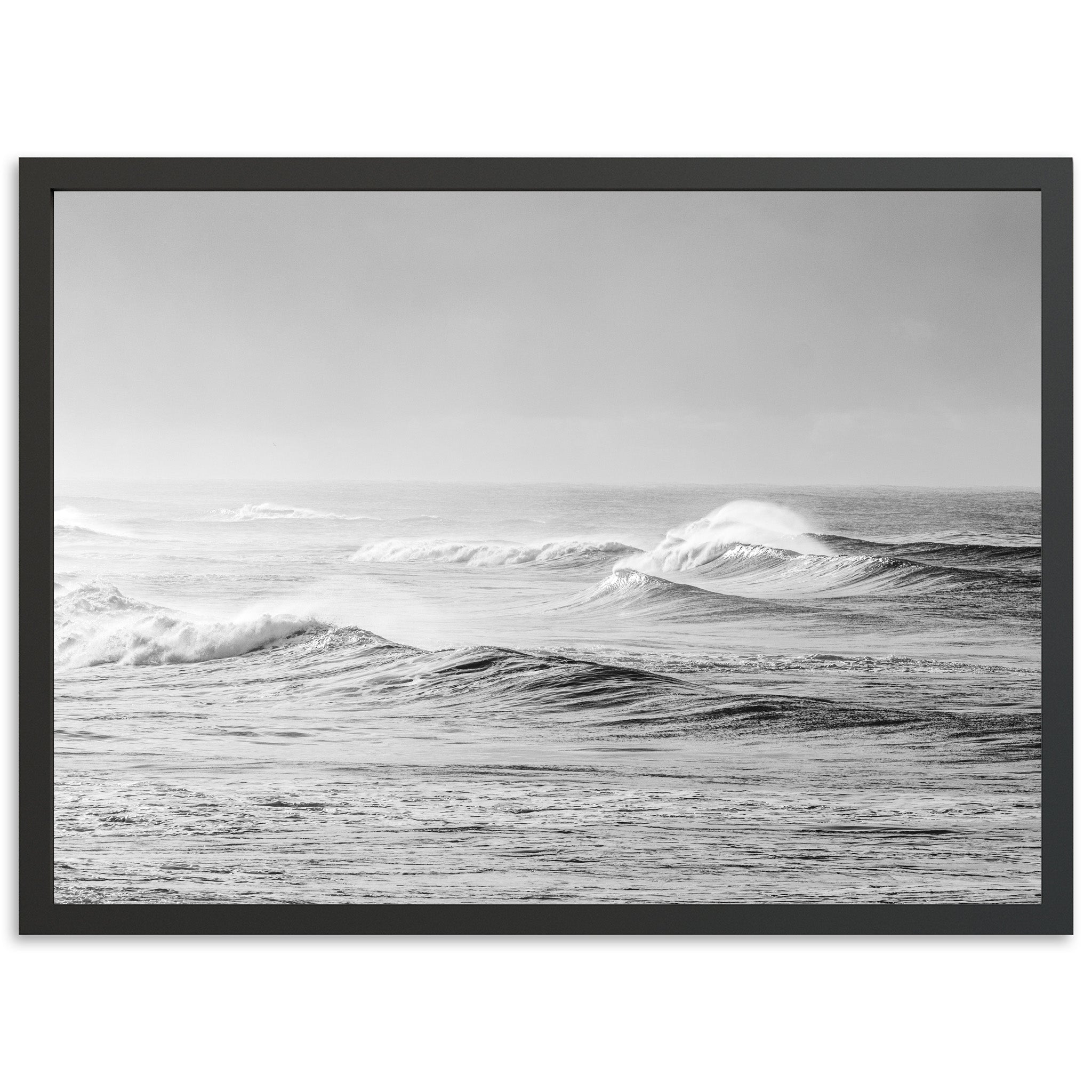 a black and white photo of waves in the ocean