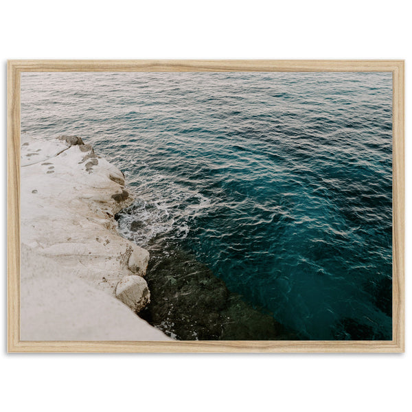 a picture of a body of water next to a cliff