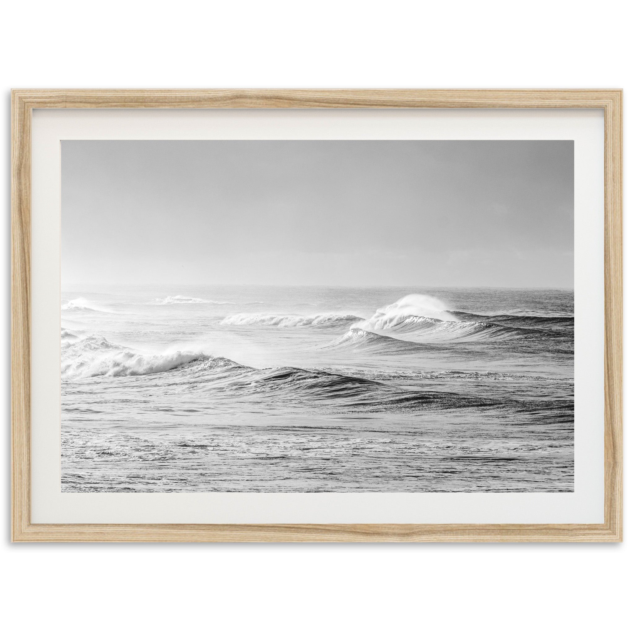 a black and white photo of waves in the ocean