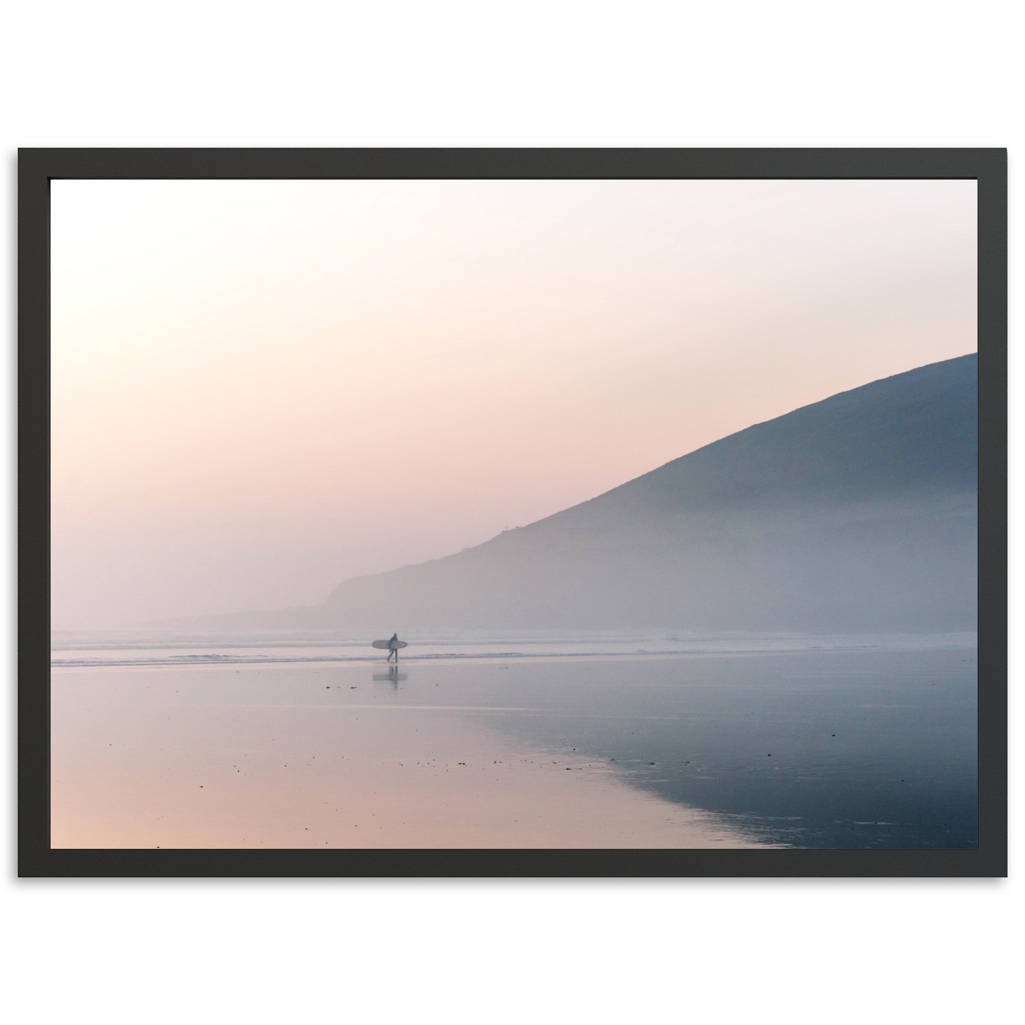 a person standing in the water with a surfboard