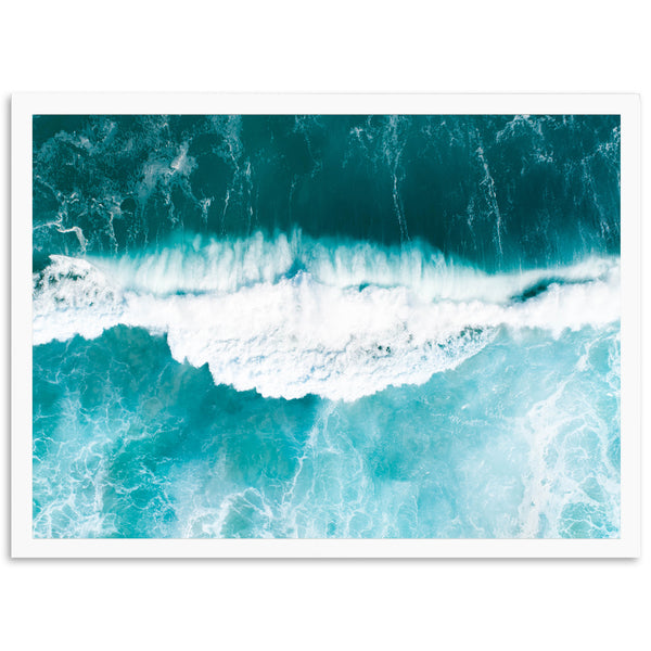 an aerial view of the ocean waves