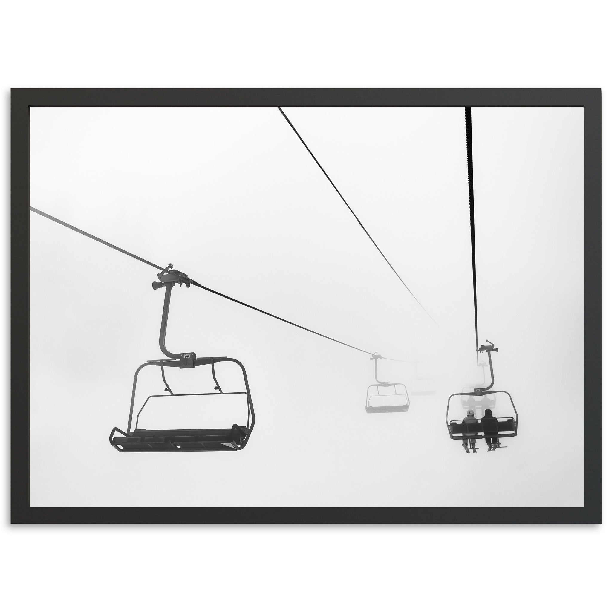 a black and white photo of a ski lift