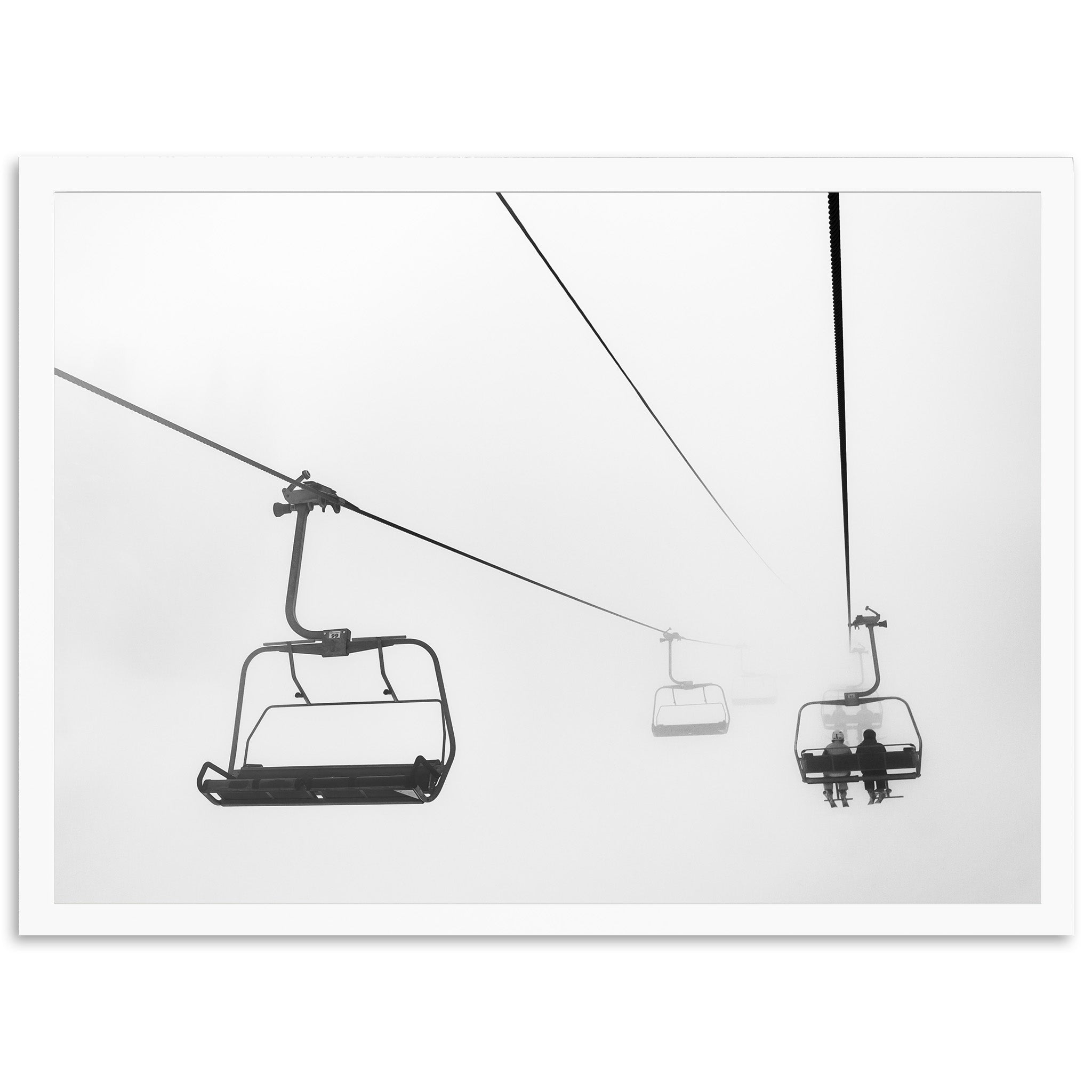 a black and white photo of a ski lift