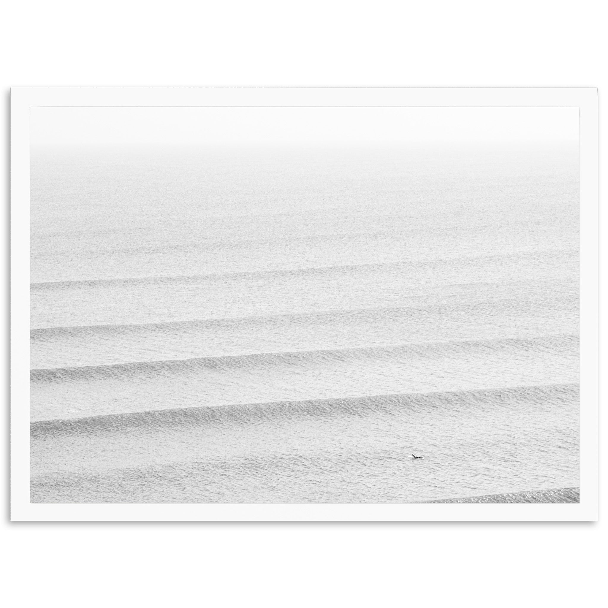 a black and white photo of waves in the ocean