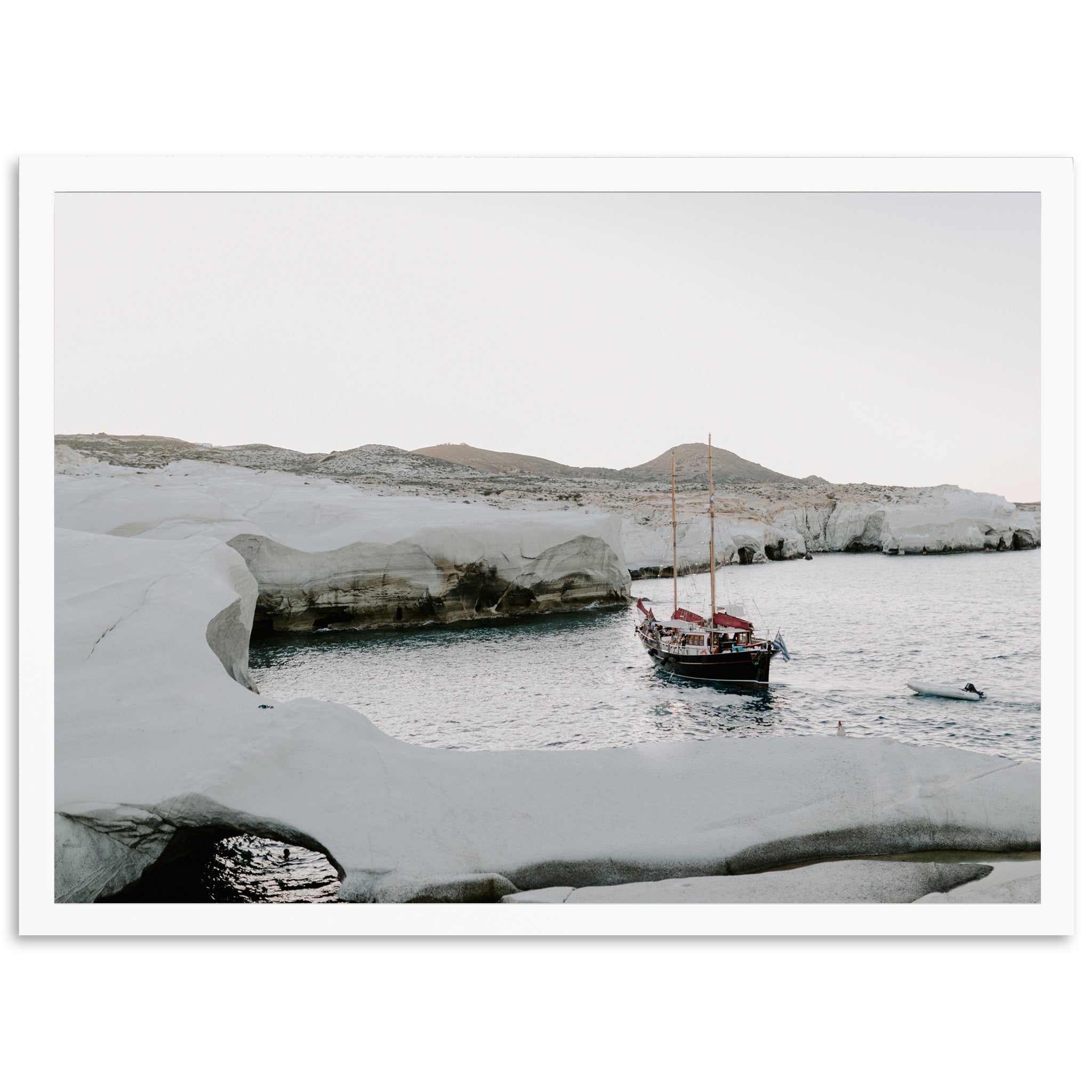 a boat in a body of water surrounded by snow