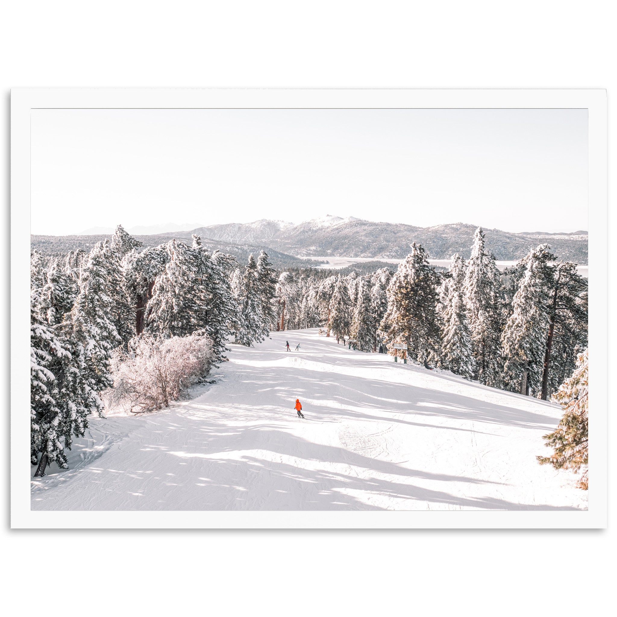 a person skiing down a snow covered slope