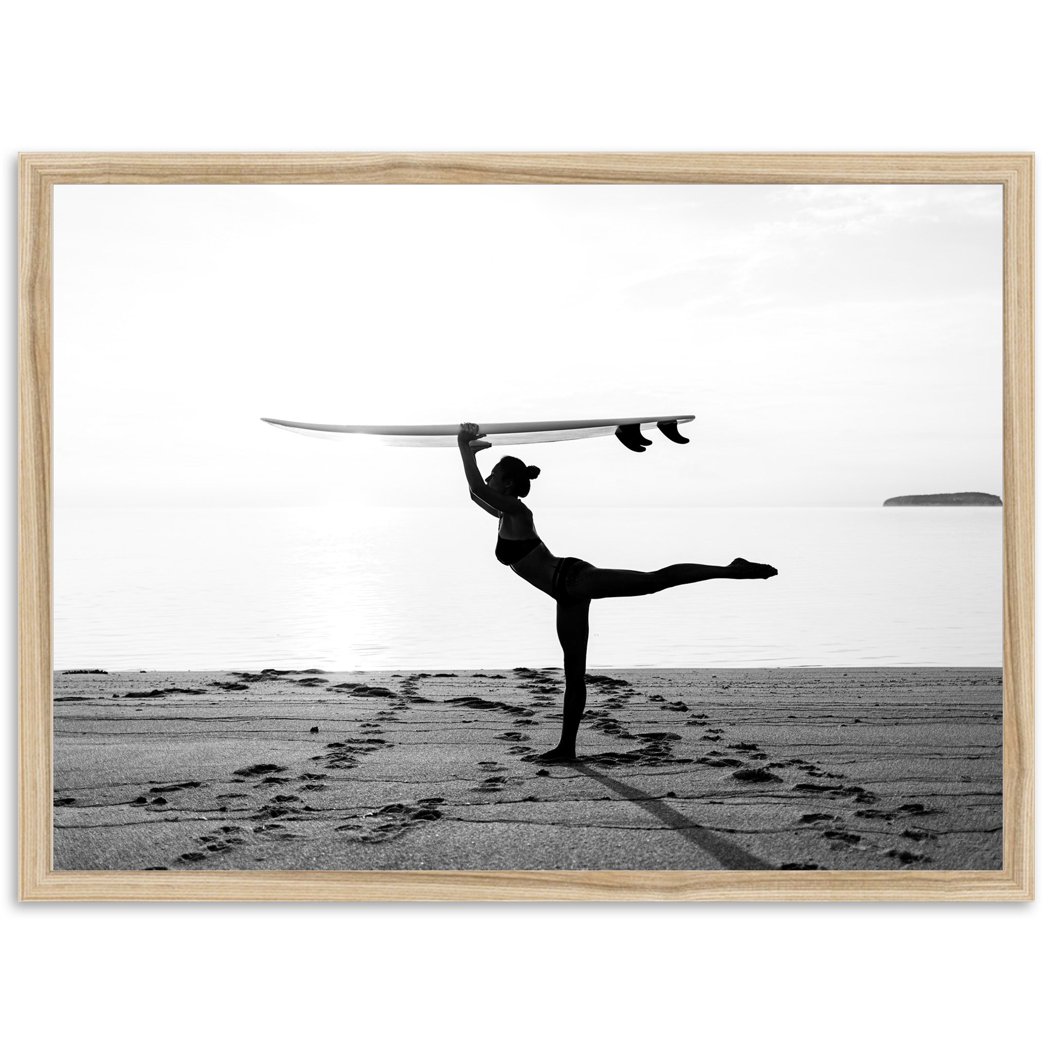 a man holding a surfboard over his head on a beach