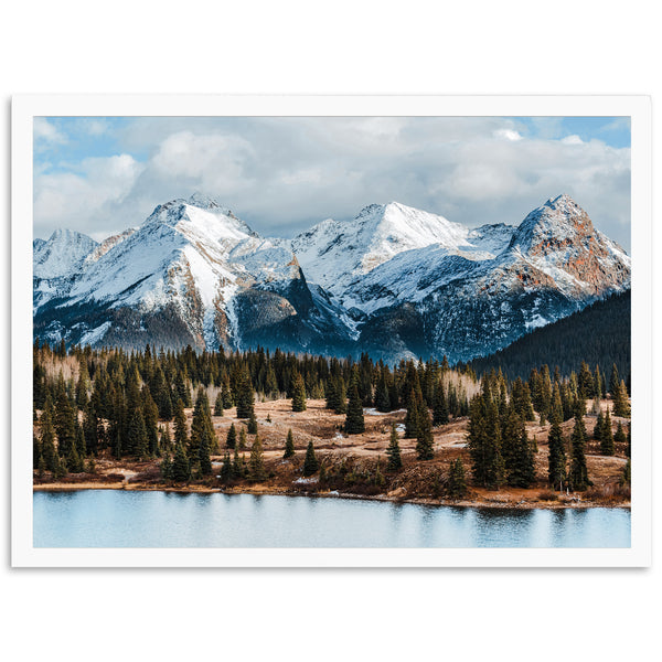 a picture of a mountain range with a lake in the foreground