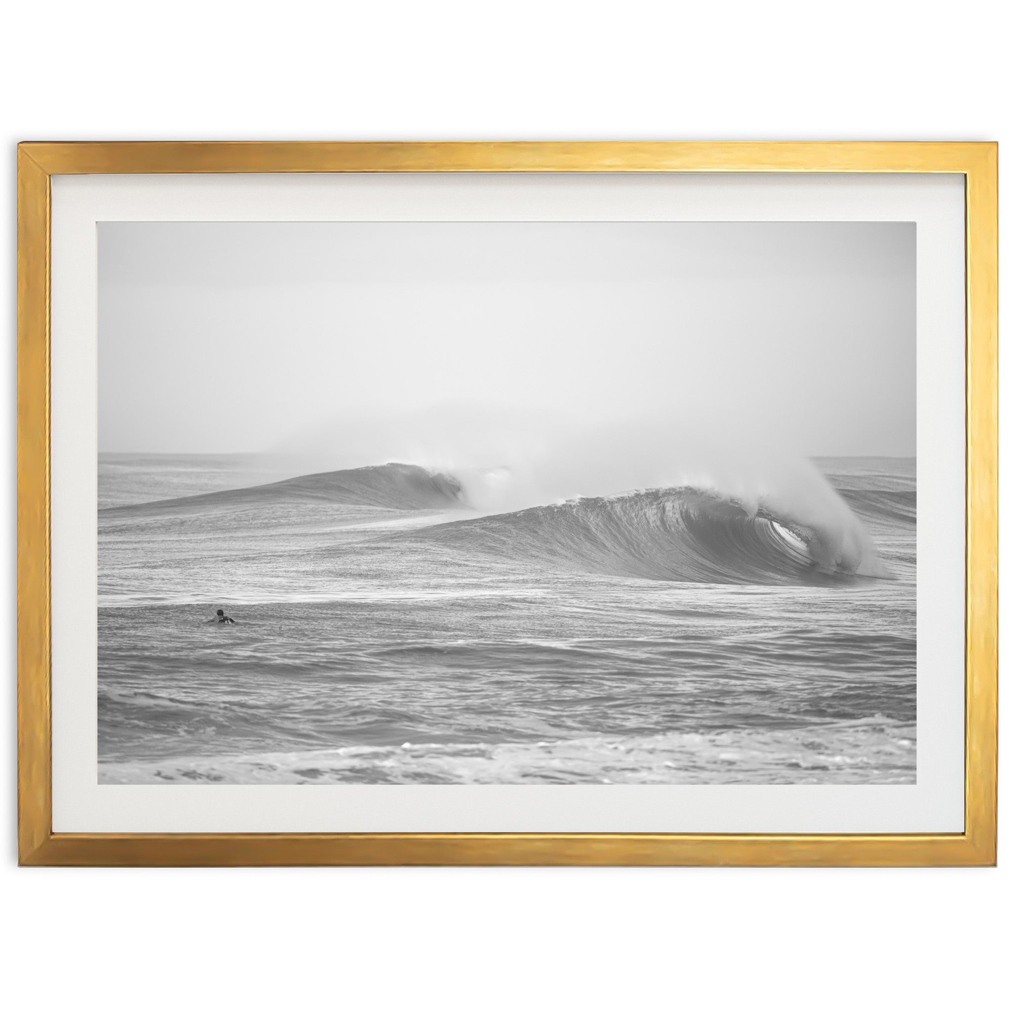 a black and white photo of a wave in the ocean